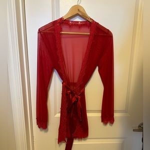 Red stretch sheer w lace long sleeve robe. Fits small /medium.